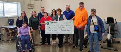 Dieterich Bank Team members pose with Community Support Systems consumers and volunteers.