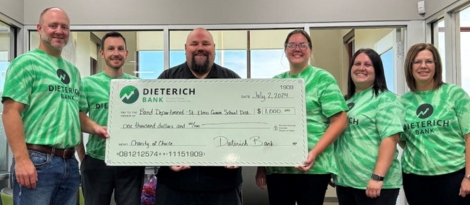 Dieterich Bank team members posing with St. Elmo Community School District Band Director.