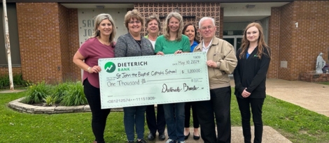 Group of Red Bud Employees donating money to St. John's School.
