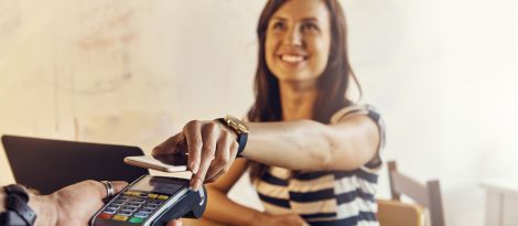 a woman tapping to pay