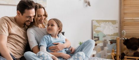 Couple with their daughter at home.