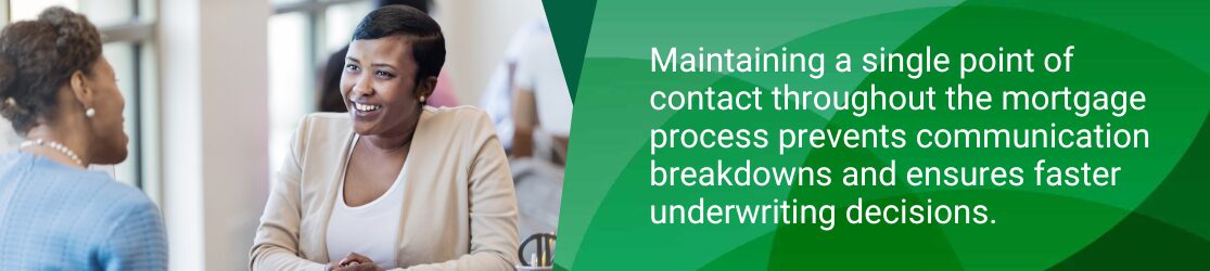Mortgage loan officer meeting with a customer while discussing communication and underwriting during the home loan process.